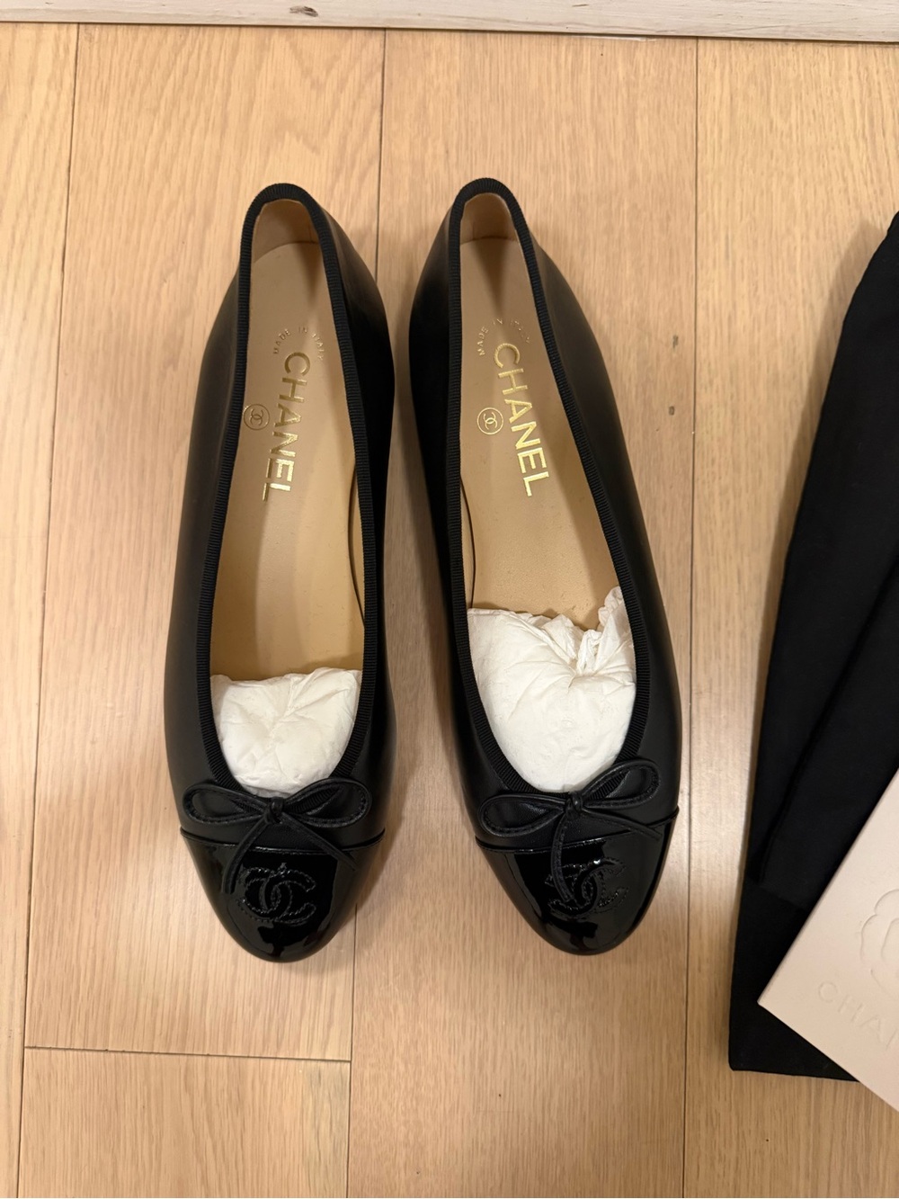 CHANEL Black Leather Ballet Flats with Patent Cap Toe and Bow - Picture 3 of 5